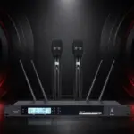 UR702 receiver with two black handheld microphones on a dark presentation background