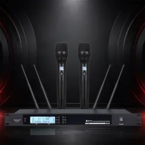 UR702 receiver with two black handheld microphones on a dark presentation background