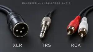 Three-pin XLR, 6.35 mm TRS and red-and-white RCA audio connectors on a dark background.